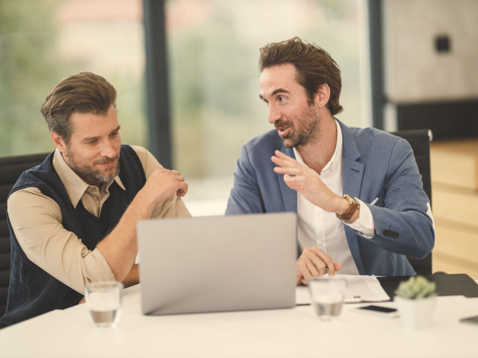 Two colleagues in conversation
