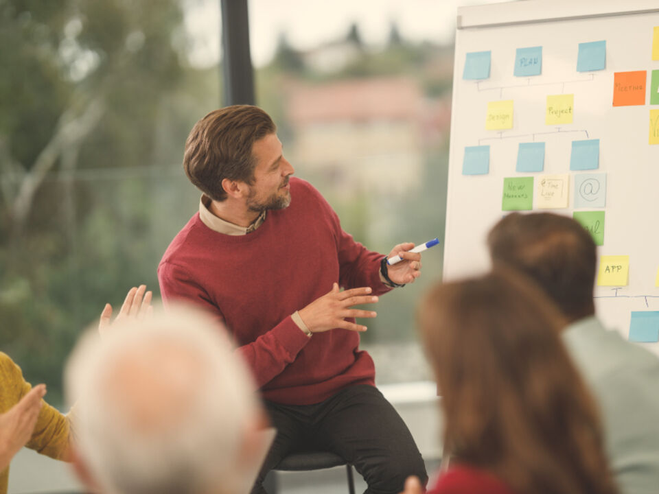 A person presenting to colleagues